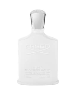 Creed Silver Mountain Water parfümünün ikonik beyaz şişesi ve gümüş kapağı