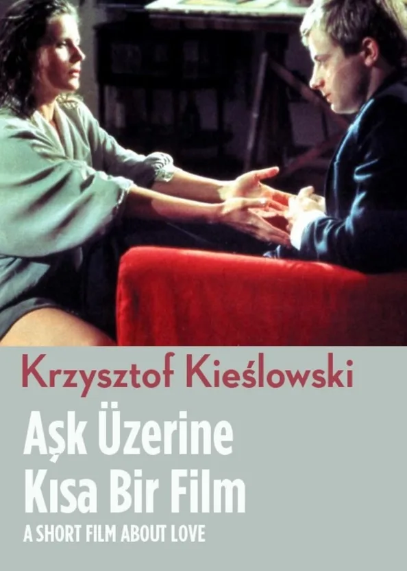 Bir film afişi birbirine bakan iki kişi ve yakınlaşan eller