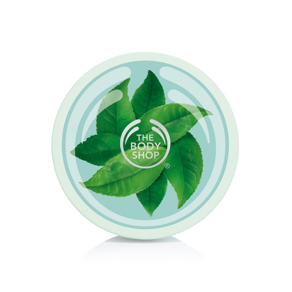 The Body Shop yeşil çay yapraklı ve logosu olan dairesel ürün kapağı