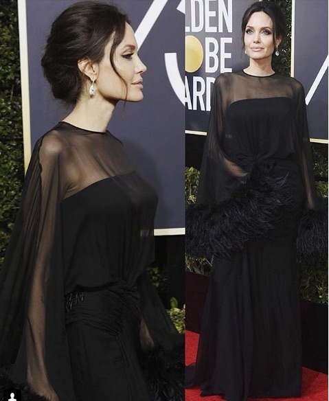 Angelina Jolie, siyah tül ve tüy detaylı elbiseyle kırmızı halıda